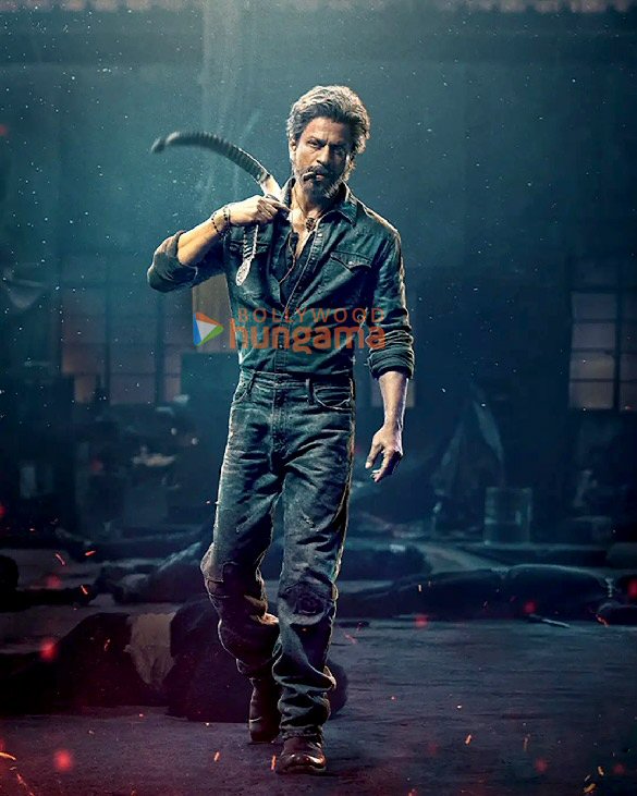 Shah Rukh Khan in a rugged avatar from Jawan, holding a weapon in an intense scene from the action-packed Bollywood film produced by Red Chillies Entertainment